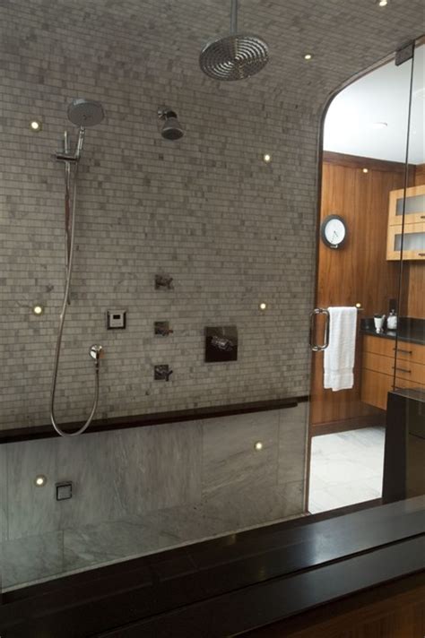 The shower and bath are spaces for functional lighting. LED lights and curved shower ceiling.