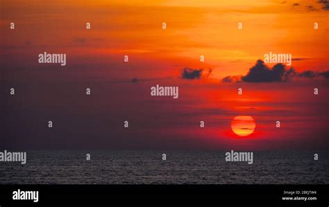 Red Sunset Over Ocean Stock Photo Alamy