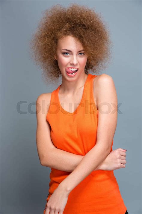 Curly Seductive Flirty Girl Showing Tongue Stock Image Colourbox