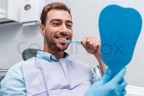 Cropped View Of Dentist Holding Mirror Stock Image Colourbox