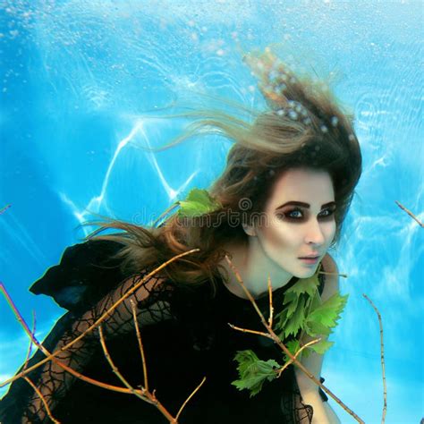 Underwater Fashion Portrait Of Beautiful Young Woman Stock Image