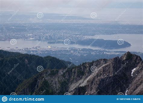 Aerial View Of Grouse Mountain With Downtown City In The Background