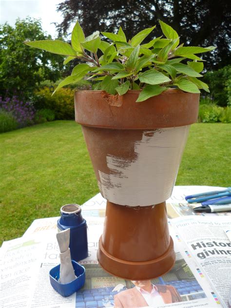 Use milk paint or chalk paint and then seal with wax or a coating of polyurethane your brush on. Painting your plant pot