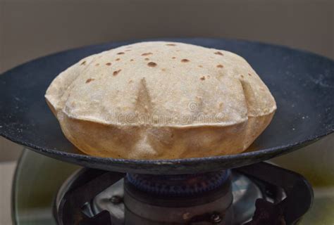 Making Roti Indian Chapati On Roti Tawa Made Of Wheat Dough Stock Photo