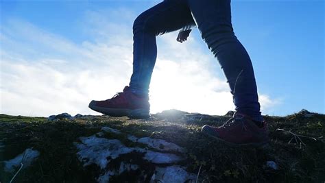Female Hiker Walking On Rough Terrain Foot Steps In Slow Motion
