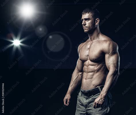 Male Bodybuilder Fitness Model Trains In The Gym Stock Photo Adobe Stock