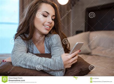 Woman Lying On The Bed And Using Smartphone Stock Image Image Of Device Communication 61752549