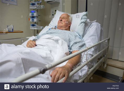 Elderly Man 83 Recovering In His Hospital Bed In The Cardiac Ward