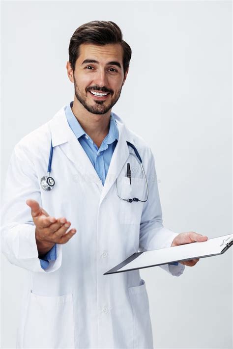 Man Doctor In White Coat With Stethoscope And Folder For Notes And