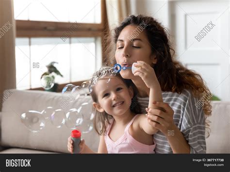 Close Mother Blowing Image Photo Free Trial Bigstock