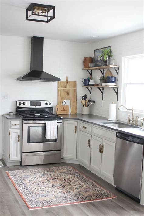 If you have a marble backsplash that features gray tones, try using a gray color on the cabinets to create a concise look. 15 Rooms with Mindful Gray by Sherwin Williams (+ Kitchen Cabinets Makeover!) - Craftivity Designs