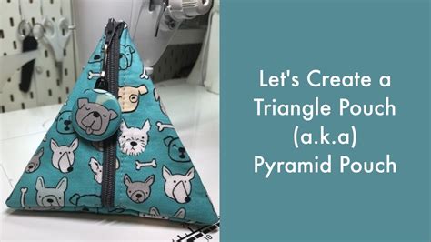 There Is A Triangle Pouch With Dogs On It And The Words Lets Create A