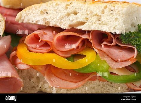 Cross Section Of Sandwich With Ham And Garnish Cut Out Serving Halved