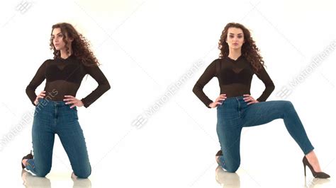2 Videos In One Curly Haired Girl In Black Body And Jeans Kneeling On A White Stock Video