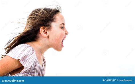 Angry Girl Jumping On A Bed Stock Photography 7303778