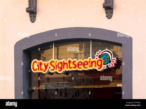 City Sightseeing Sign In A Window Of A Shop In Seville Spain Stock