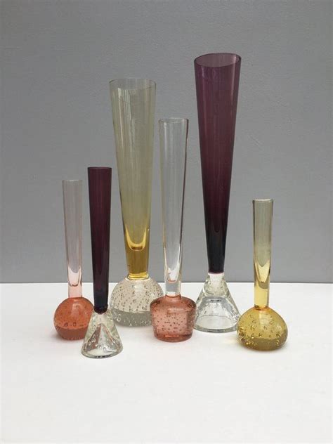 Handblown Single Stem Glass Vases In Varying Colours And Heights Which Form An Eye Catching