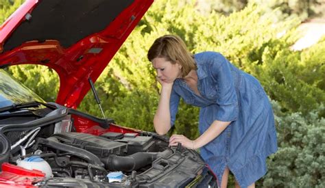 Desperate And Confused Woman Stranded On Roadside With Broken Car