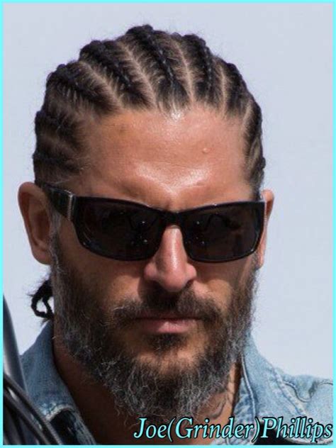A Man With Long Braids And Sunglasses