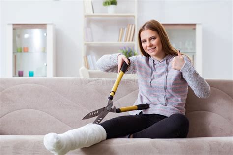 The Young Woman With Broken Leg At Home Stock Photo Image Of Health