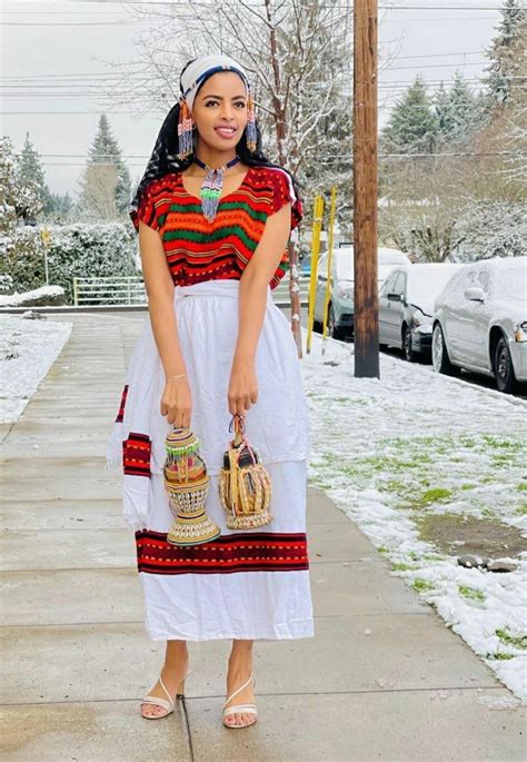 Beautiful Oromo Woman Wearing Bale Attire And Holding Traditional Milk