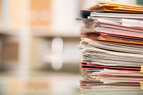 Large Stack Of Files Documents Paperwork On Desk Stock Photo Download