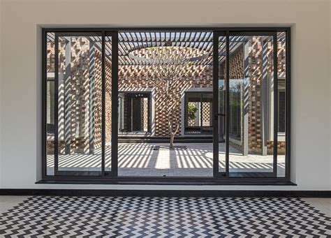Brick Facade House Rlda Architecture Gives A Perforated And Projected