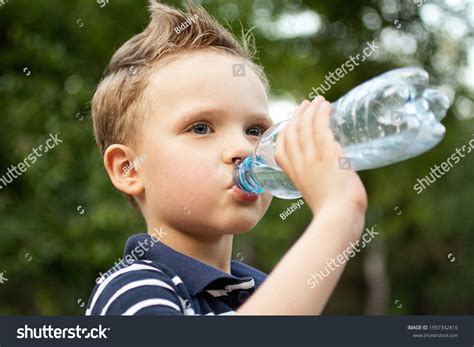 Stylish Boy Drinking Water Plastic Bottle Stock Photo 1997342816