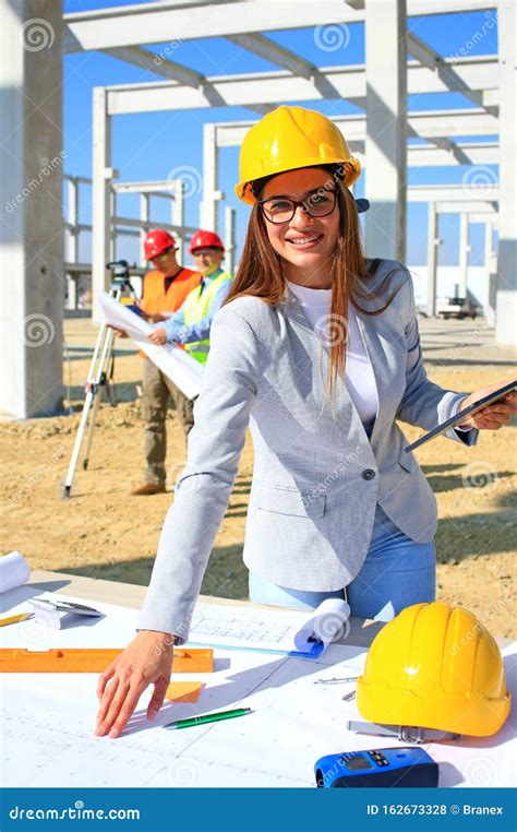Happy Beautiful Female Architect On Construction Site Stock Photo