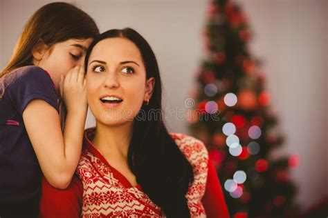 daughter telling her mother a christmas secret stock image image of room homey 45100713