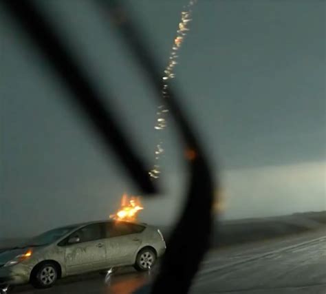 Storm Chaser Captures Exact Moment Lightning Bolt Strikes Car