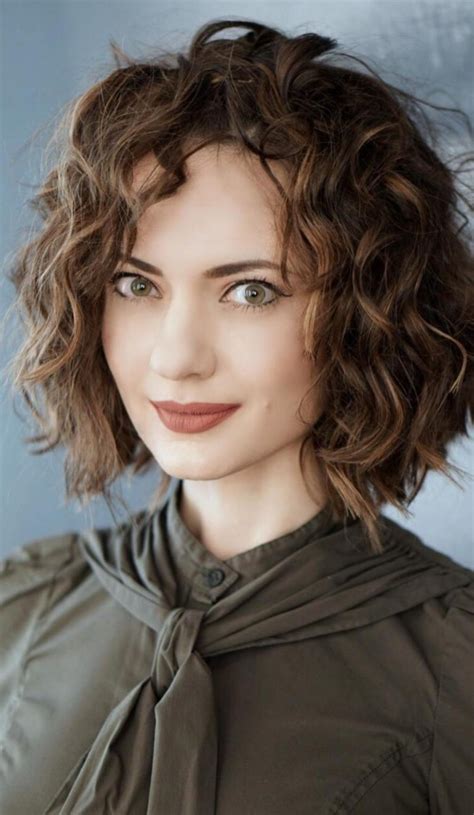 This mohawk style with brunette hair color is a great example of unique short hairstyle. 42 Darling Short Curly Hair styles for Refreshed Look
