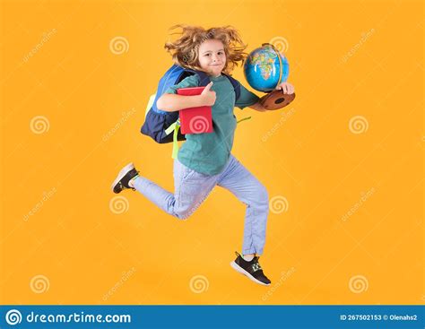 Shool Kid Jump With School Bag And Globe School Boy In School Uniform