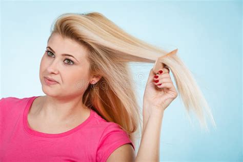 Woman Brushing Her Long Blonde Hair With Comb Stock Photo Image Of