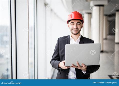 Handsome Male Engineer Is Using A Notebook For Work Stock Image