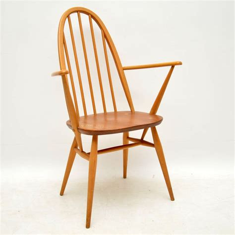 2nd hand dining chairs with mocha faux leather upholstered seats. 1960's Vintage Ercol Grand Windsor Dining Table & Six ...