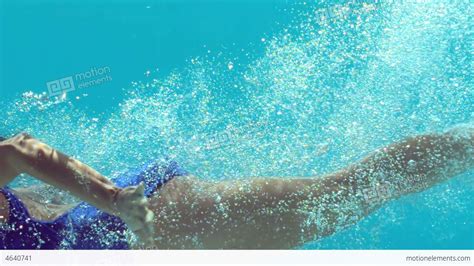 Brunette Woman Swimming Underwater Stock Video Footage 4640741
