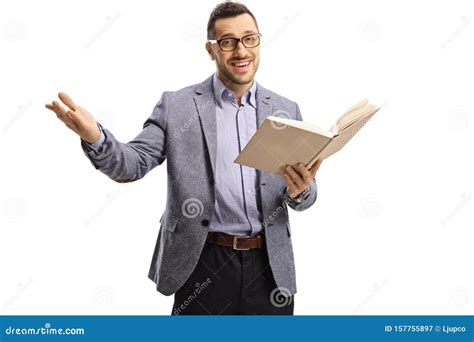 Young Man Standing And Holding An Open Book And Gesturing With Hand