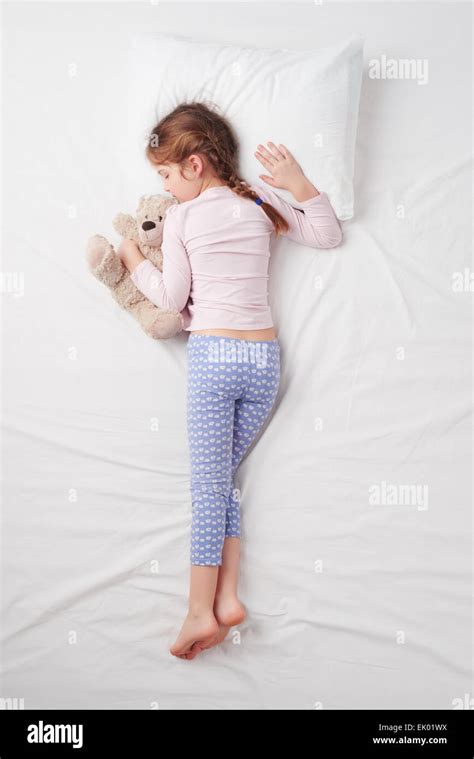 Top View Of Little Cute Girl Sleeping With Teddy Bear Stock Photo Alamy
