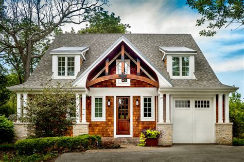 Craftsman Features Shed Dormers And Square Columns On Stone Piers