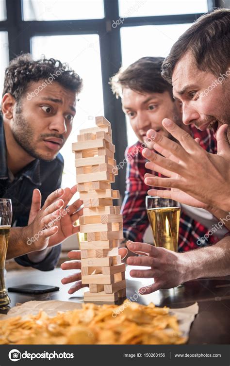 Since its debut at the 1983 london toy fair, it's been sold worldwide. men playing jenga game — Stock Photo © ArturVerkhovetskiy ...