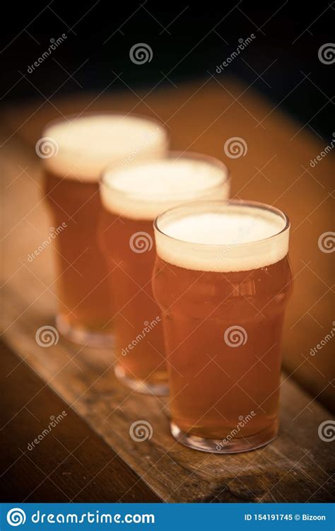 Three Pints Of Beer In A Row Stock Image Image Of Amber Froth 154191745