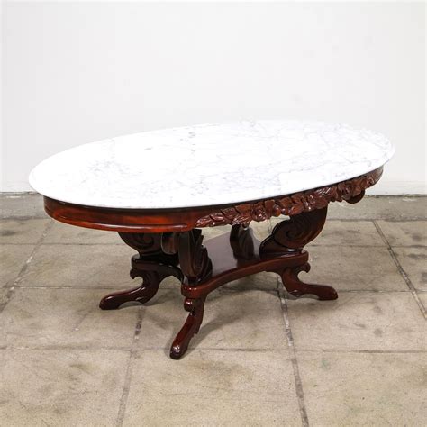 Antique victorian oval coffee table, inlaid walnut. This victorian coffee table is featured in a solid wood ...
