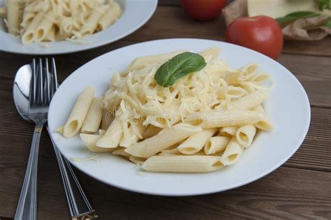 Cooked Penne Pasta With Butter And Cheese Isolated In White Round