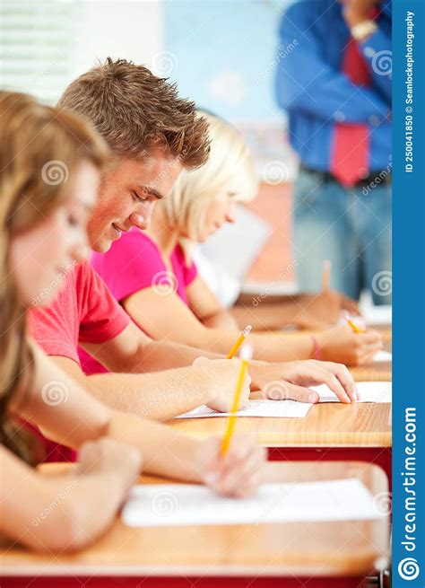 High School Students Taking Test At Desks Stock Photo Image Of