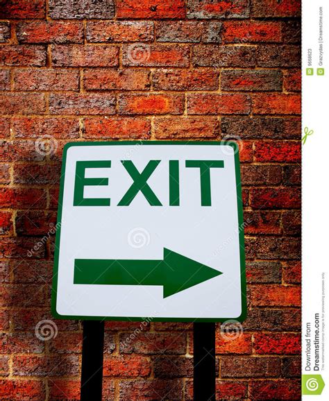 Exit Direction Sign On Brick Wall Background Stock Image