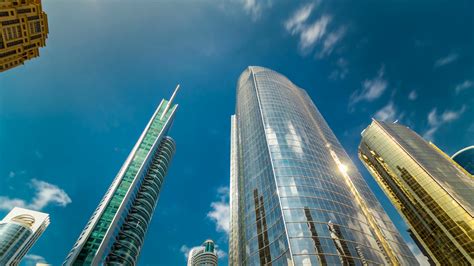 Low angle view of generic modern business skyscrapers ,high rise buildings with abstract geometry glass and cement facades. Free photo: High-rise Glass Building - Architectural ...