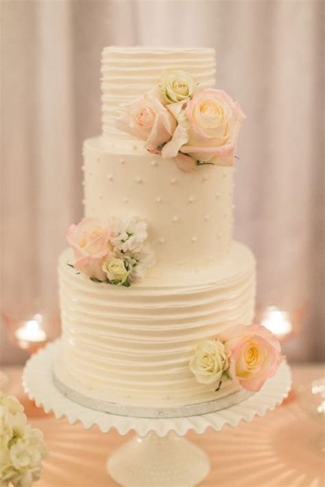 3 tier white wedding cake with fondant drapes , edible · 24 gorgeous wedding cakes ideas with fresh flowers · 2 tier white wedding cake with blush pink roses on . How to save on wedding cake costs -7 Ways to save on ...