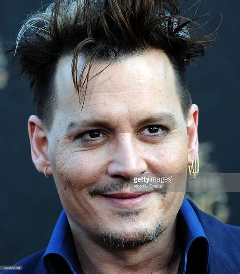 Actor Johnny Depp Arrives For The Premiere Of Disneys Alice Through