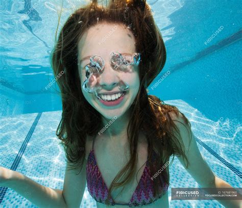 Smiling Girl Underwater In Swimming Pool Brunette Underwater View Stock Photo